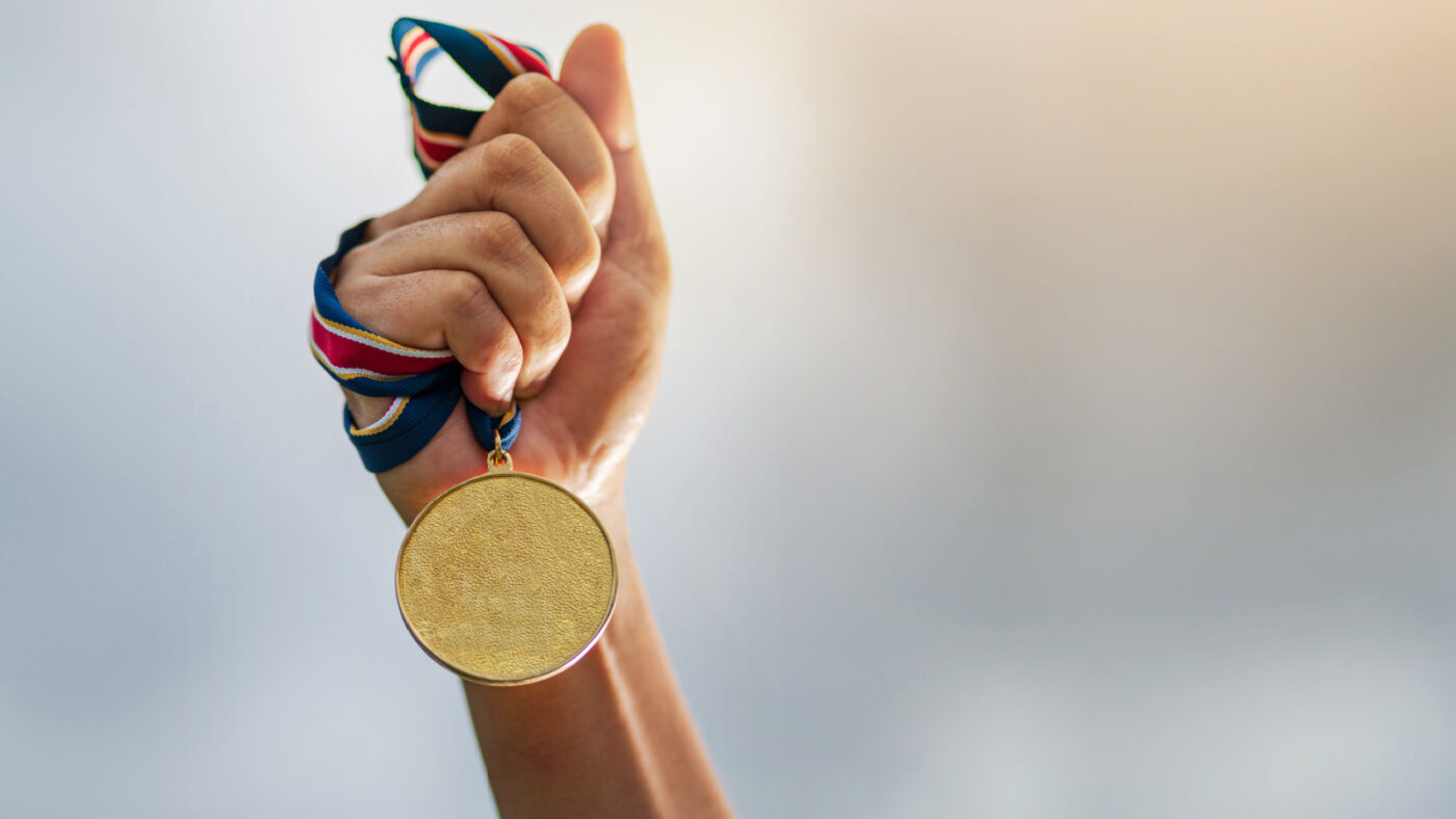 Celebrating victories in youth sports. with sports championship medals. 